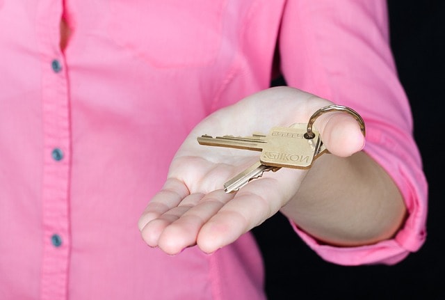 man holding house keys